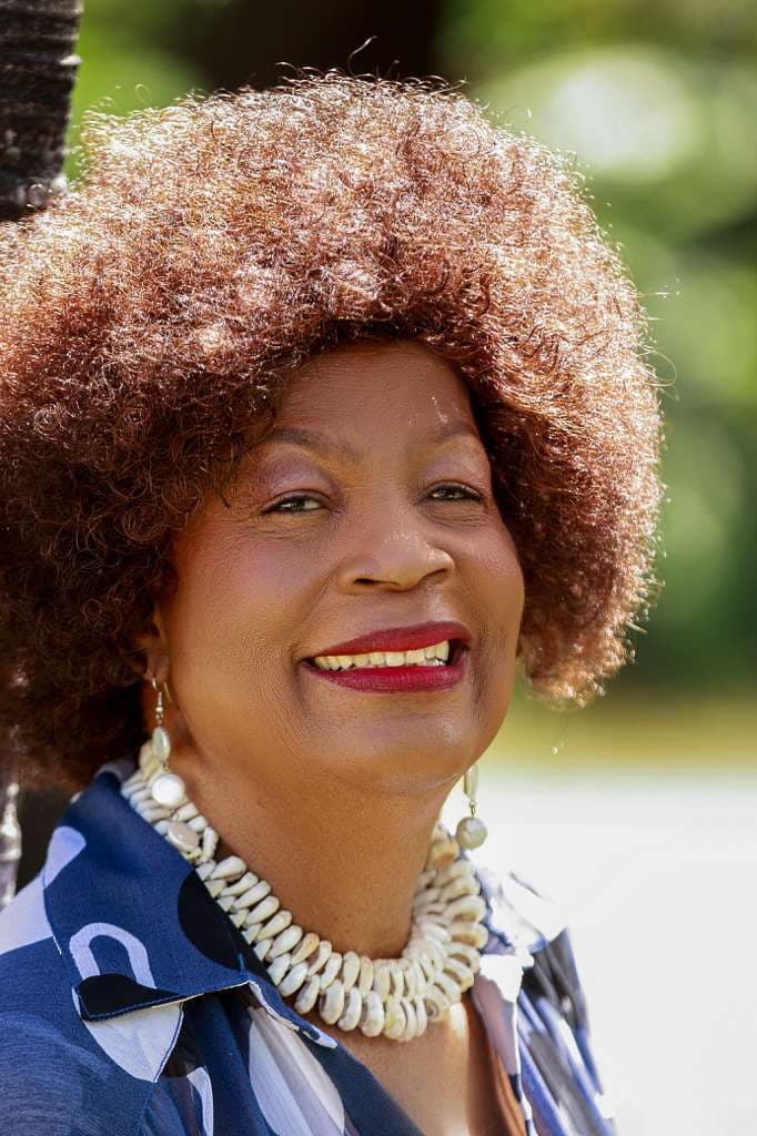 Portrait of Judy Mowatt in white
